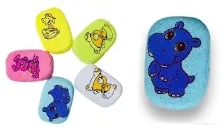 Esponjas de baño infantiles con figuras de animales como hipopótamos y ositos en diversos colores brillantes.